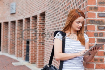 Serious student using a tablet computer