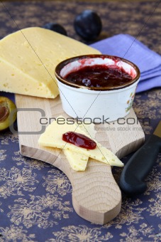 jar of plum jam and some slice cheese