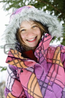 Happy winter girl in ski jacket