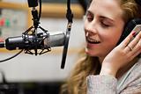 Close up of a singer recording a track