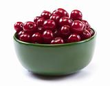 Bowl with ripe cherries. Isolated on a white background.