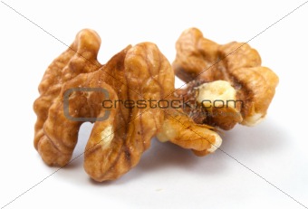 Crushed walnuts on white background