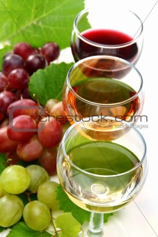 Glasses with white, pink and red wine.