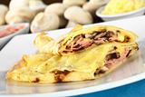 Crepes filled with ham, cheese and mushroom