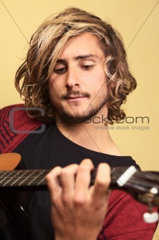Young Man Playing the Guitar