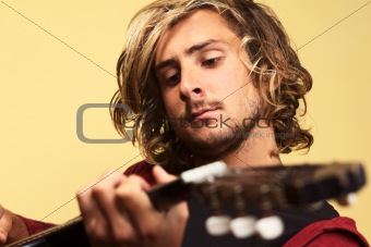 Young Man Playing the Guitar