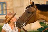 woman kissing horse