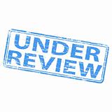 Under Review rubber stamp.