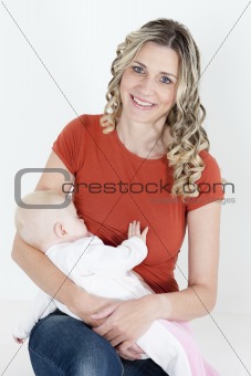 portrait of mother nursing her baby