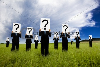 group of businessman in black suit and holding question mark symbol