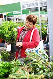 Senior woman buying plants