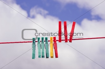 clothes-pegs on red string
