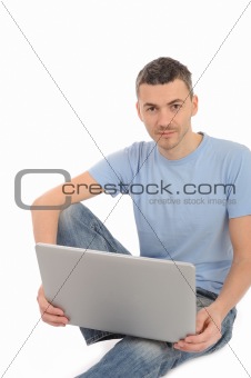 handsome young male working on laptop computer. isolated