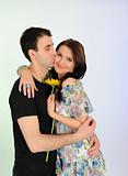 lovely romantic couple with flower embracing