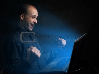 happy businessman with laptop