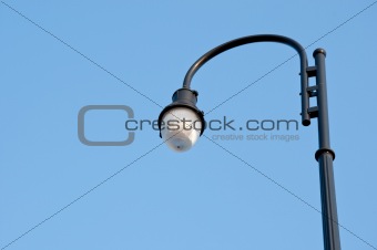 Lamp post in clear blue sky