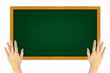 hand holding green blackboard