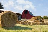 Roll of Hay by the Red Barn