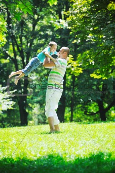 happy father and son have fun at park