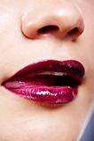 Girl's lips with dark red lipstick