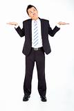 Young businessman shrugging and isolated on white