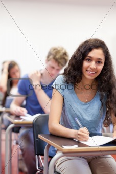 Portrait of smiling students working on an assignment