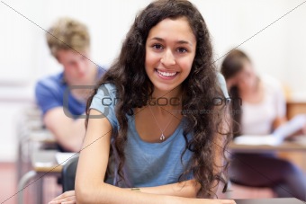 Happy student working on an assignment