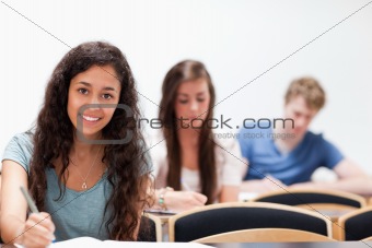 Smiling young students sitting
