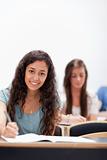 Portrait smiling young students sitting