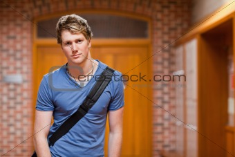 Handsome student standing up