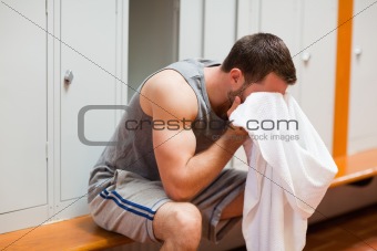 Sports student drying his head