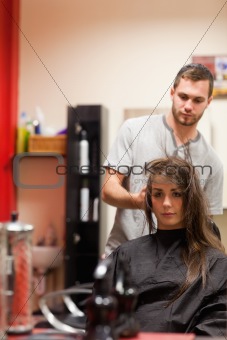 Portrait of a hairdresser blowing hair