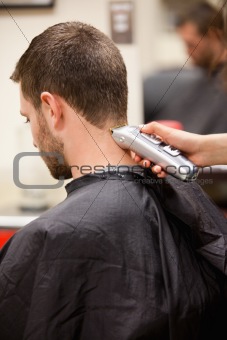 Portrait of man having a haircut