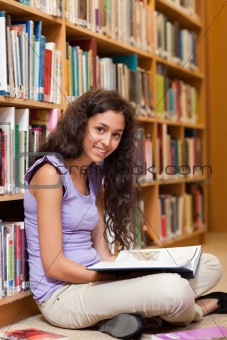 Portrait of a female student with a book