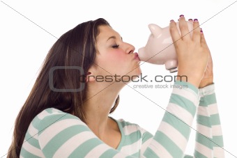 Pretty Ethnic Female Kissing Her Pink Piggy Bank Isolated on a White Background.