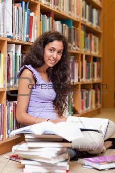 Portrait of a happy student with a book