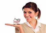 Pretty Smiling Ethnic Female Holding Small House in Hand Isolated on a White Background.