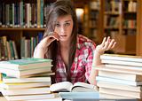 Disappointed student having a lot to read