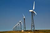 The wind generators against the blue sky