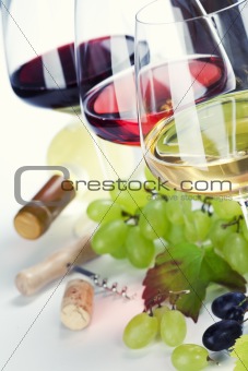 Glasses of white, red and rose wine and grapes 