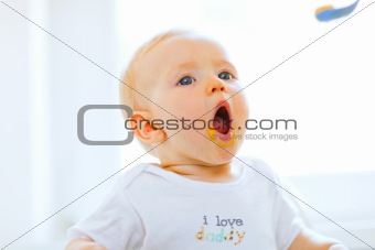 Eat smeared lovely baby open mouth for spoon
