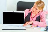 Modern business woman showing laptops blank screen
