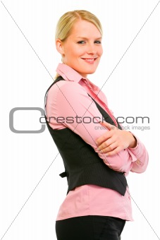 Profile portrait of smiling business woman with crossed arms on chest

