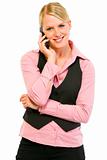 Smiling business woman talking on mobile phone

