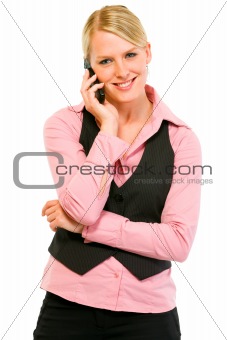Smiling business woman talking on mobile phone
