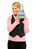 Smiling business woman holding gift bag
