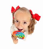 Little girl with large lollipop