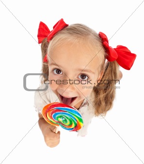 Little girl with large lollipop
