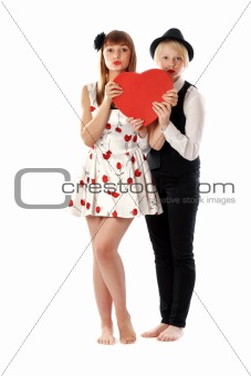 Two girls with red cardboard heart
