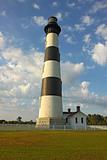 Bodie Island lighthouse, blue sky and white clouds vertical